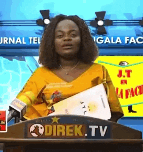 a woman is standing behind a podium that says direk tv