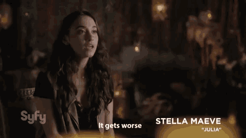 a woman is sitting in front of a sign that says stella maeve julia on it