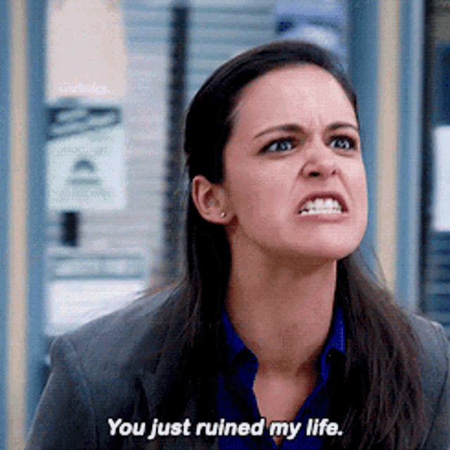 a woman is making a funny face and saying you just ruined my life