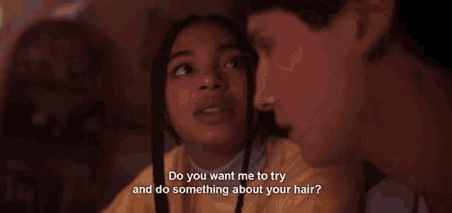 a man and a woman are looking at each other and the woman is asking the man to try and do something about her hair