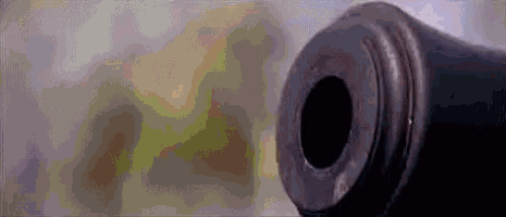 a close up of a cannon barrel with a hole in it .
