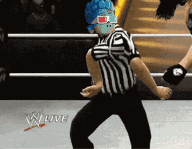 a referee in a wrestling ring with the word live on the floor