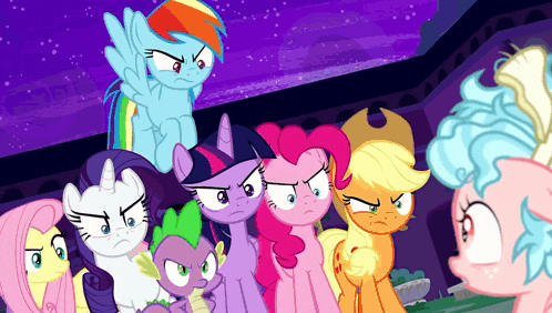 a group of ponies standing next to each other with angry faces on their faces