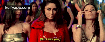 a woman in a red jacket is standing next to two other women and says but i love you