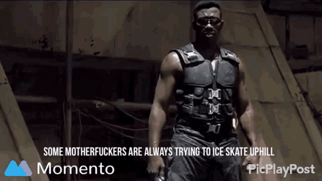 a picture of a man holding a gun with the caption " some motherfuckers are always trying to ice skate uphill momento "