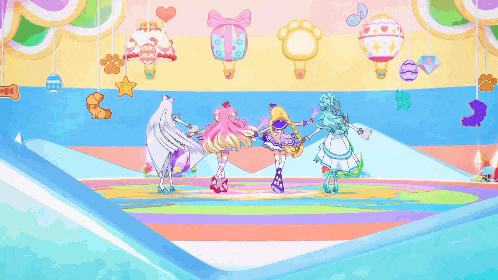 a group of anime girls are dancing on a stage with balloons in the background