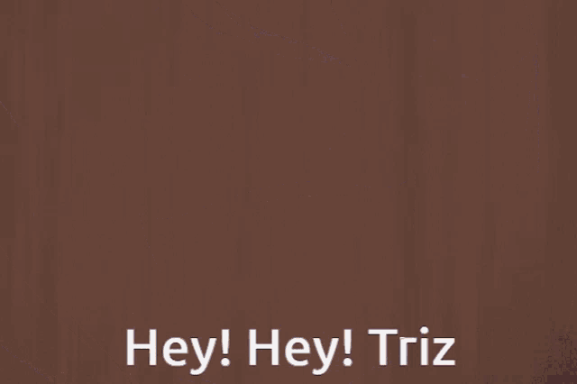 a close up of a person 's face with the words hey ! hey ! triz below it