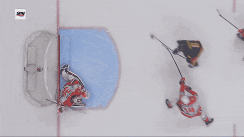 an aerial view of a hockey game with the sn logo on the bottom