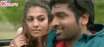 a man and a woman are sitting next to each other in a car and smiling .