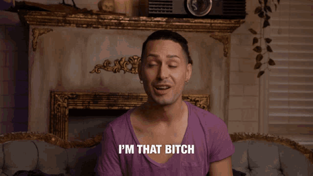 a man in a purple shirt is saying " i 'm that bitch "