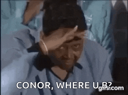 a man in a blue shirt is holding his hand to his forehead and saying `` conor , where u b? ''