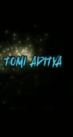 a blurred image of a christmas tree with the letter a in the upper left corner