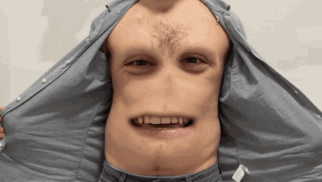 a man 's shirt has a label on it that says ' cotton ' on it