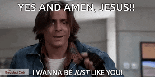 a man says yes and amen jesus while holding a microphone