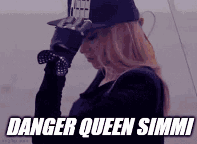 a woman wearing a hat and gloves with the words `` danger queen simmi '' written above her .