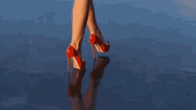 a person laying on their back in the water with their arms outstretched