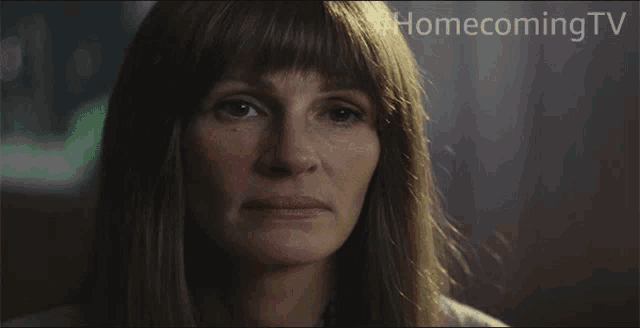 a close up of a woman 's face with the words #homecoming tv written above her