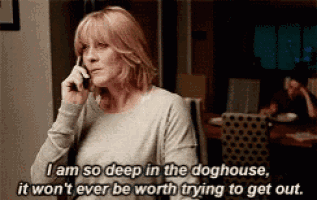 a woman is talking on a cell phone and says i am so deep in the doghouse