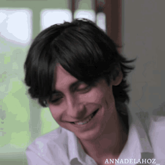 a close up of a person 's face with the name annadelahoz written on the bottom