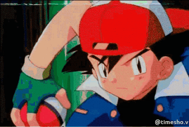 a pixelated image of a boy with a red hat