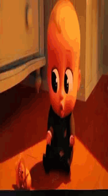 a cartoon baby is laying on a table next to a dresser