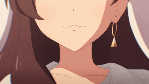 a close up of a woman 's face with earrings