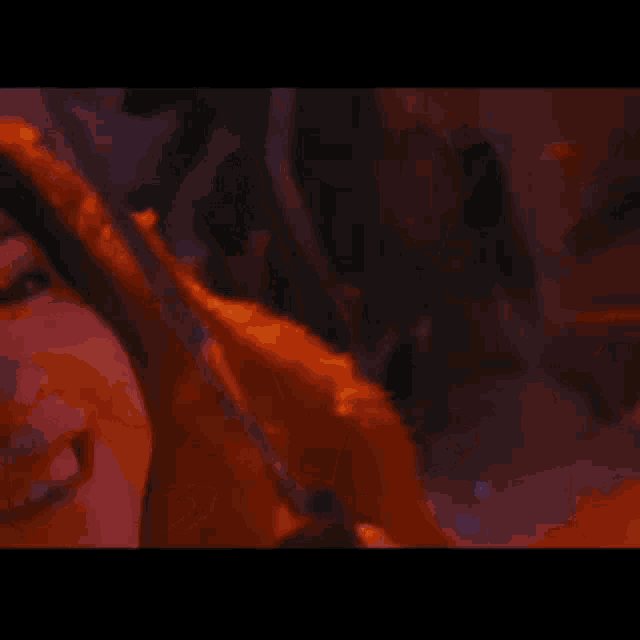 a close up of a woman 's face in red light