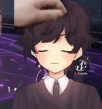 a person is putting a hand on a boy 's head .