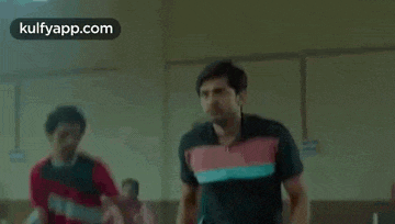 a man is holding another man 's neck while they are fighting .