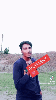 a young man is holding a red sign that says excellent