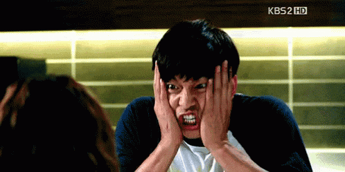 a man is making a funny face in front of a kbs2 hd screen