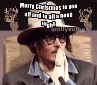 a man wearing a hat and glasses is saying merry christmas