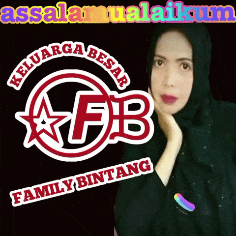 a woman stands in front of a logo for keluarga besar fb family bintang