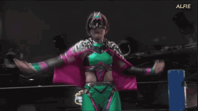 a woman in a green and pink costume with the word alfie at the bottom