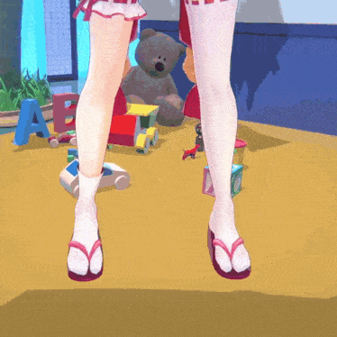 a girl wearing flip flops is standing in front of a teddy bear and a letter a