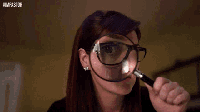 a woman wearing glasses is looking through a magnifying glass with the hashtag #impastor on the bottom