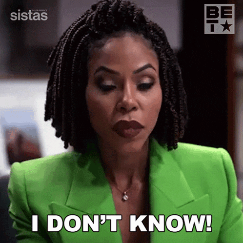 a woman in a green jacket is making a funny face and saying i don 't know .