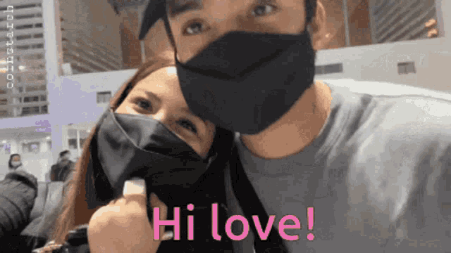a man and a woman wearing face masks and the words hi love