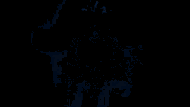 a dark background with a blue glowing object