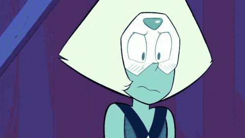 a cartoon character with a green head and a blue shirt is making a funny face .