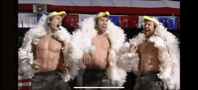 three men are standing next to each other wearing feathered jackets .