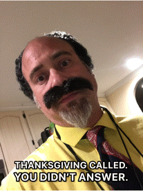a man with a fake mustache and beard is wearing a yellow shirt and tie