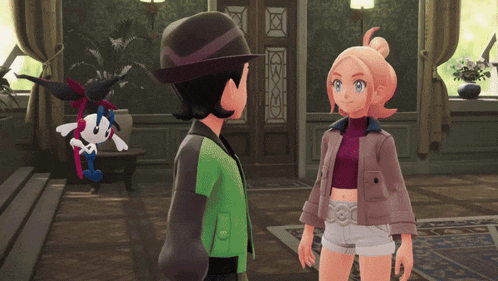 a man and a woman are standing next to each other in a room with a cartoon character in the background