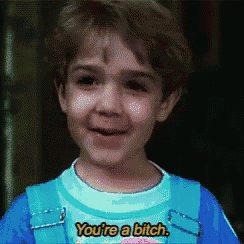 a little boy wearing a shirt that says you 're a bitch