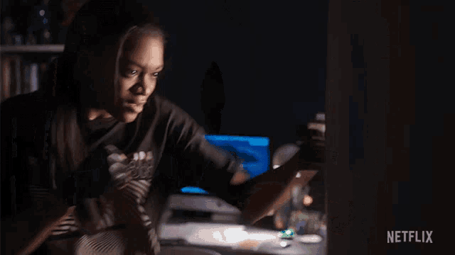 a man is boxing in a dark room with a netflix logo in the background