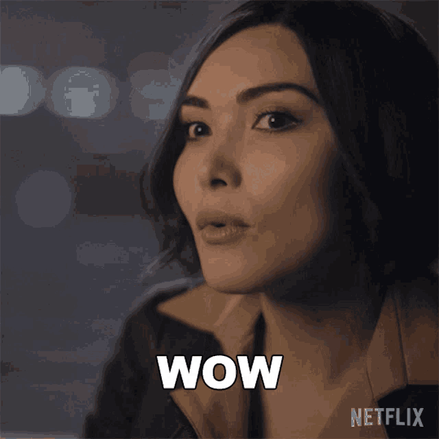 a close up of a woman 's face with the word wow written on it
