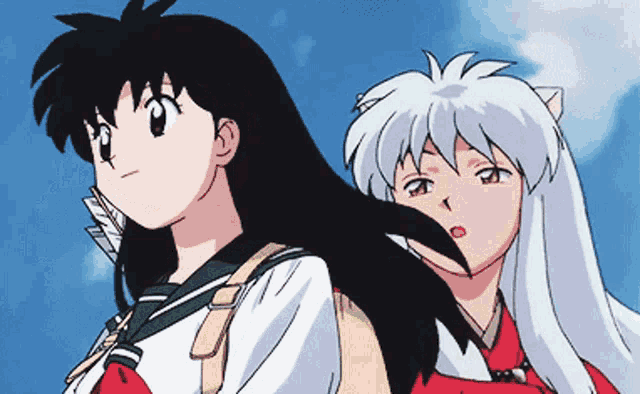 a boy and a girl are standing next to each other looking up at the sky