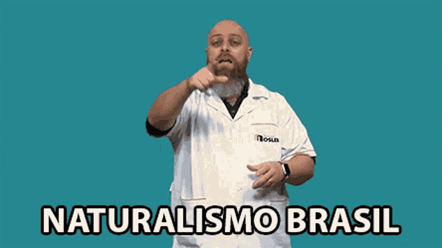 a bald man with a beard is wearing a white lab coat with the words naturalismo brasil written on it
