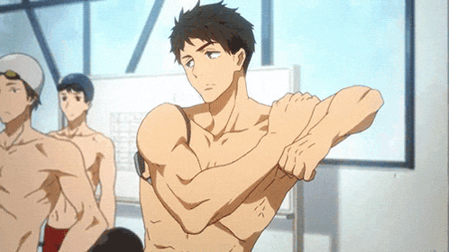 a man without a shirt is stretching his arms in a room .