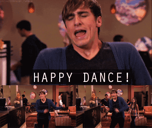 a man in a blue cardigan singing happy dance